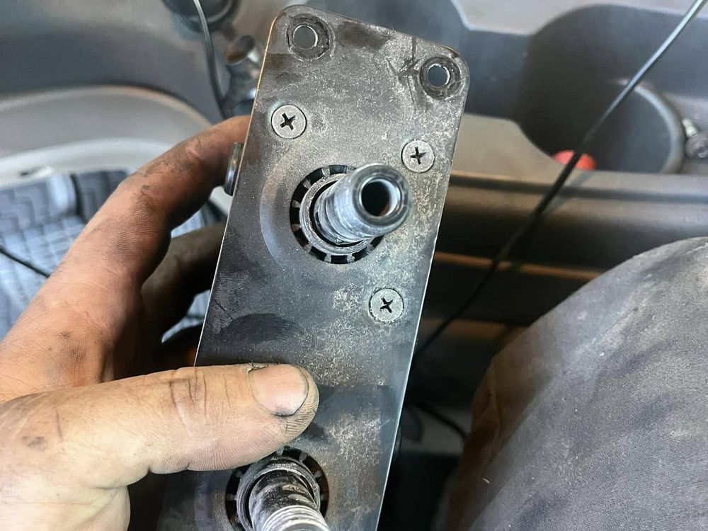 Mechanic inspecting a metal component for fabrication work